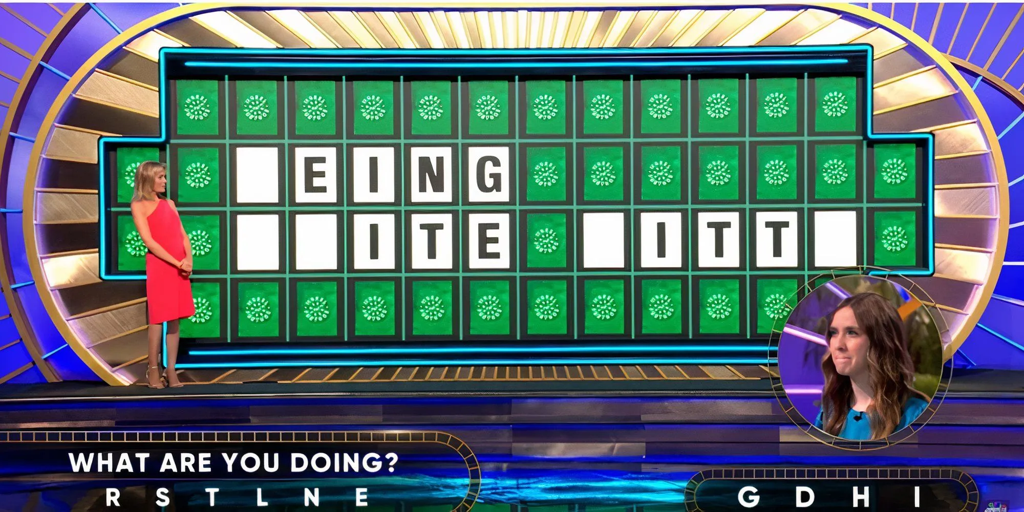 Wheel Of Fortune Vanna White and Contestant in front of the letterboard