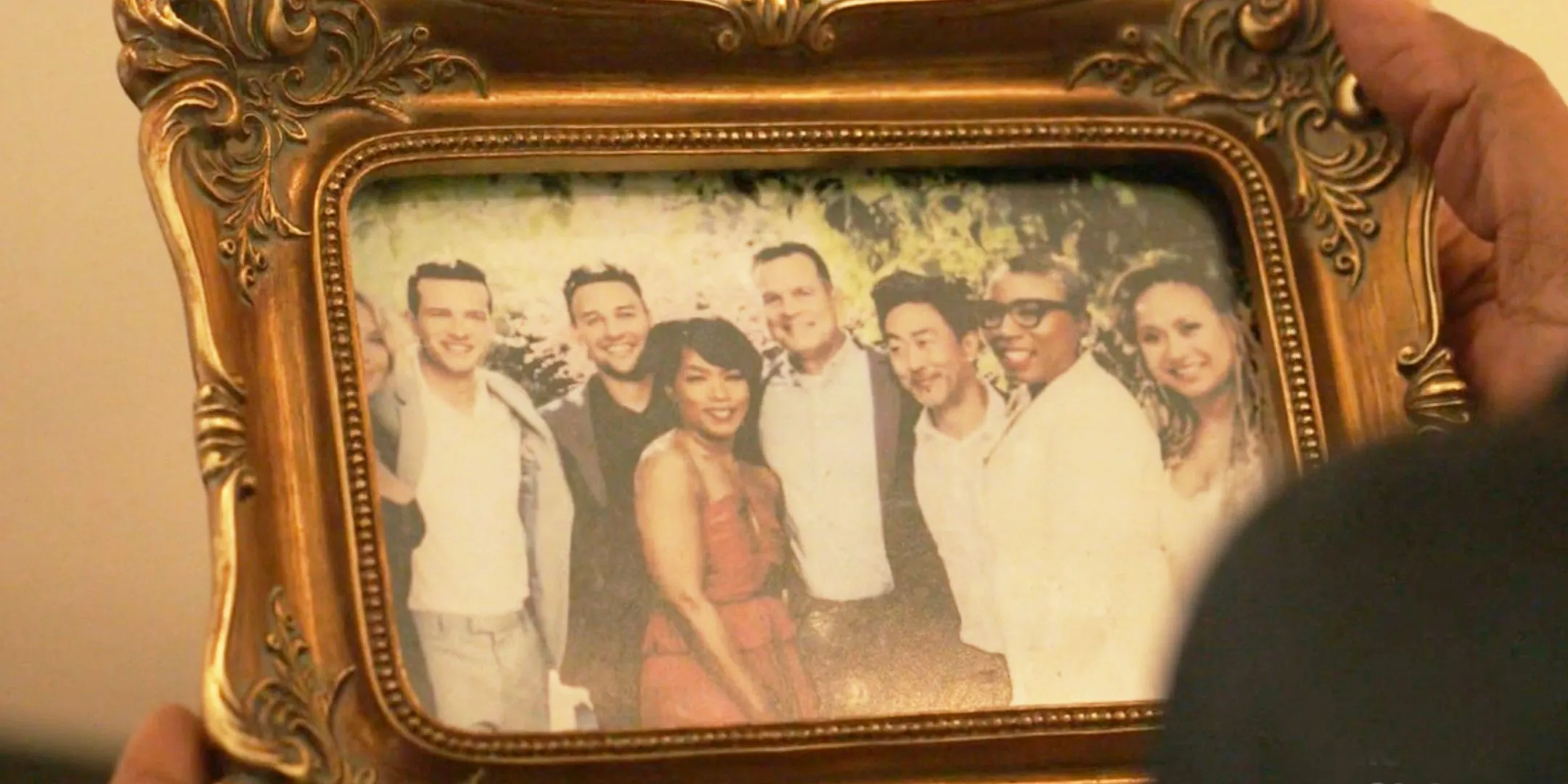 A framed picture of 9-1-1's ensemble cast. A framed picture of 9-1-1's ensemble cast.