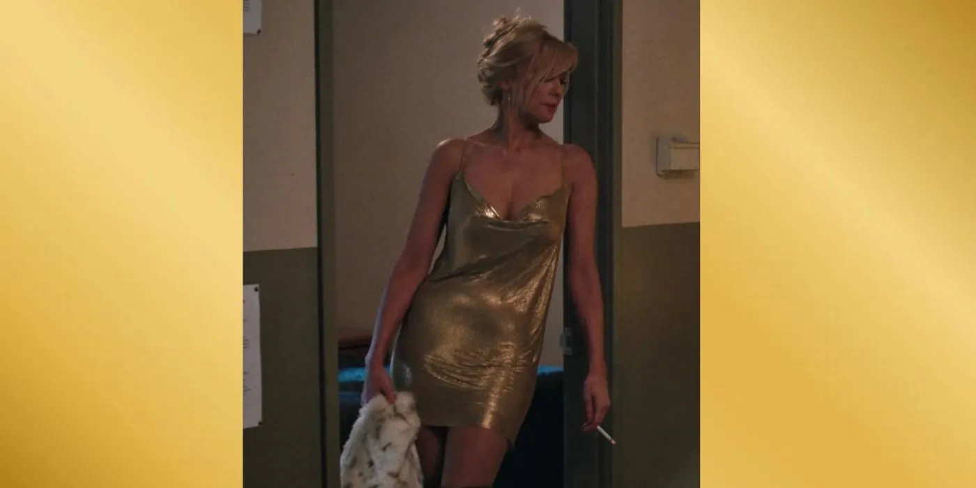 Yellowstone Beth in gold dress holding coat with gold background Yellowstone Beth in gold dress holding coat with gold background